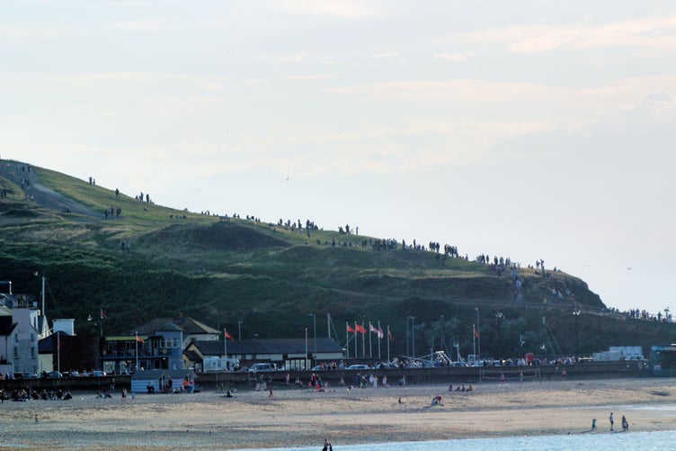 Crowds gather on Peel Hill to watch the rare astronomical phenomenon