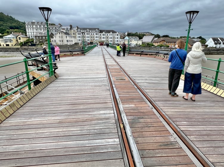 Visitors enjoy a stroll along Queen's Pier during a recent summer Sunday opening