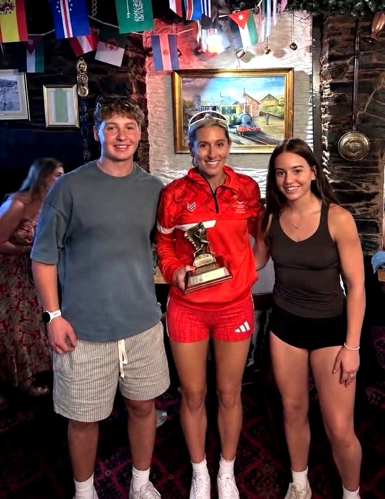 Christa Cain receives the 2026 David Teece Award for Excellence from Elliott and Carla Teece at the Baltic Hotel in Foxdale last Thursday evening (Photo: Simon Scott)