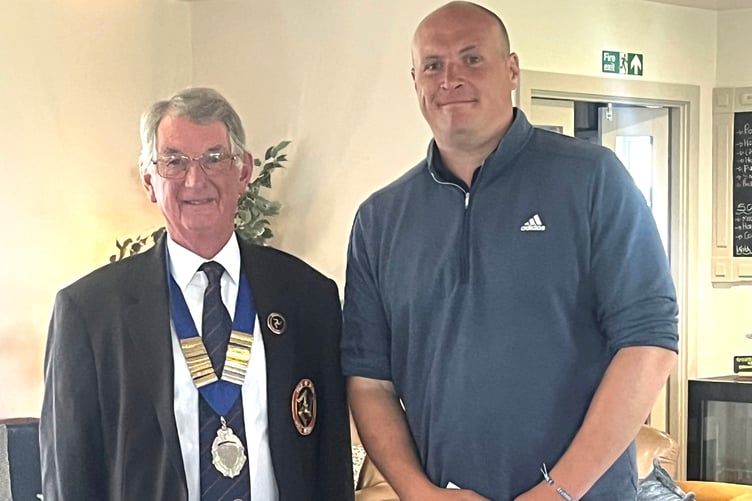 Jamie Arneil (right) was the overall runner-up in the men's competition and is pictured with Isle of Man Golf Union president Michal Kewley