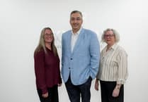 Douglas firm celebrates 20-year service of three of its staff
