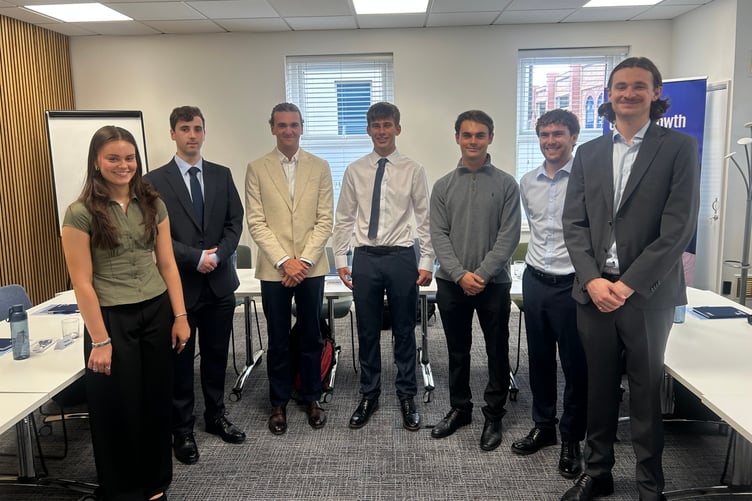 The seven new trainees at KPMG's office on Athol Street