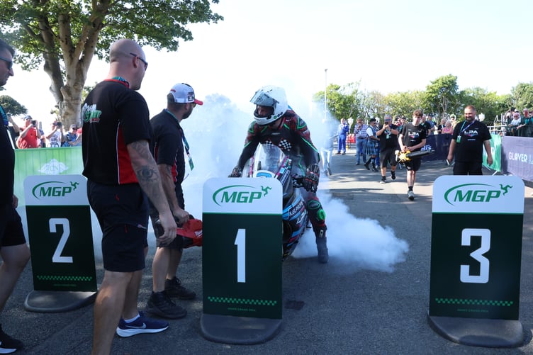 Johnny Stewart celebrates in time-honoured fashion after winning the Senior Manx Grand Prix on Monday afternoon (Photo: Callum Staley/CJS Photography)