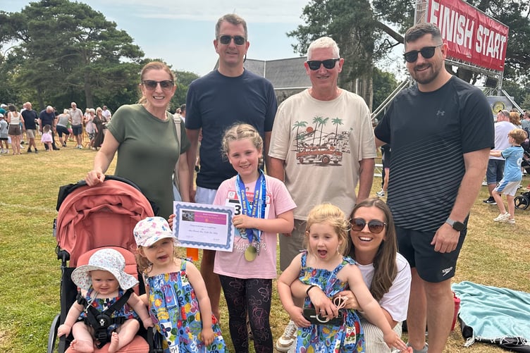 Freya pictured with her family on the day of the big race