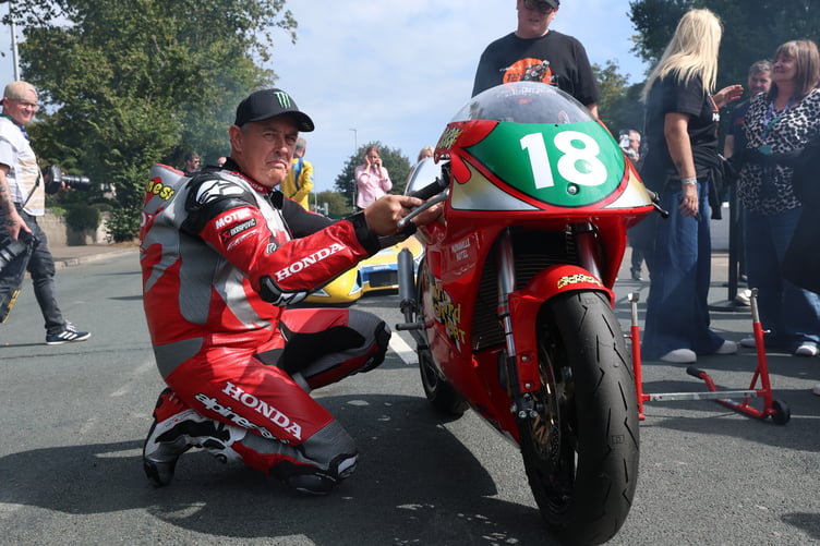 John McGuinness warming up the Paul Bird Motorsport Honda RS250 ahead of the 1996 Rewind Parade Lap (Photo: Callum Staley/CJS Photography)