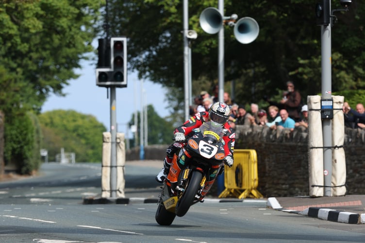John McGuinness powers the 2007 HM-Plant Honda through St Ninian's Crossroads. John revealed the Fireblade's clutch started slipping shortly after stopping him from pulling a wheelie at the Grandstand to finish the lap (Photo: Callum Staley/CJS Photography)