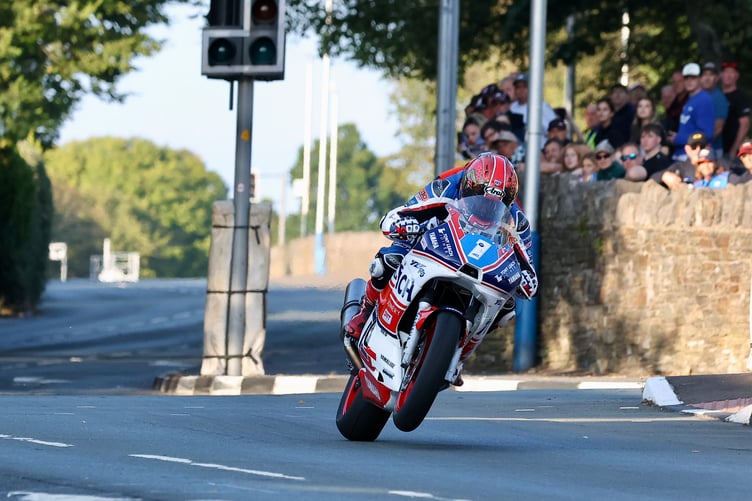 Laxey's Joe Yeardsley wheelies through St Ninian's crossroads aboard his Tony Leach Joinery Yamaha R6 on his way to finishing a fine third in Monday evening's Junior 600 Classic TT (Photo: Baylon McCaughey)