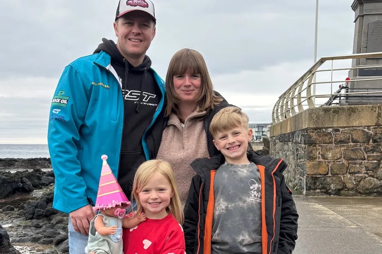 A beautiful family: Daniel Ingham sadly died during this year's Isle of Man TT qualifying in May, and wife Helayna now fears the family, including children Phoebe and Joey, may lose their home