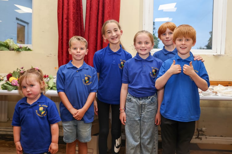 Children repping the 'St Johns Produce show' merch
