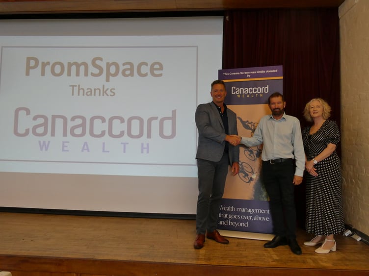 Tom Richards (left) head of wealth management, Isle of Man, Canaccord Wealth, presents a new cinema screen to Juan Clarke and Anne Cowell from PromSpace, Promenade Methodist Church