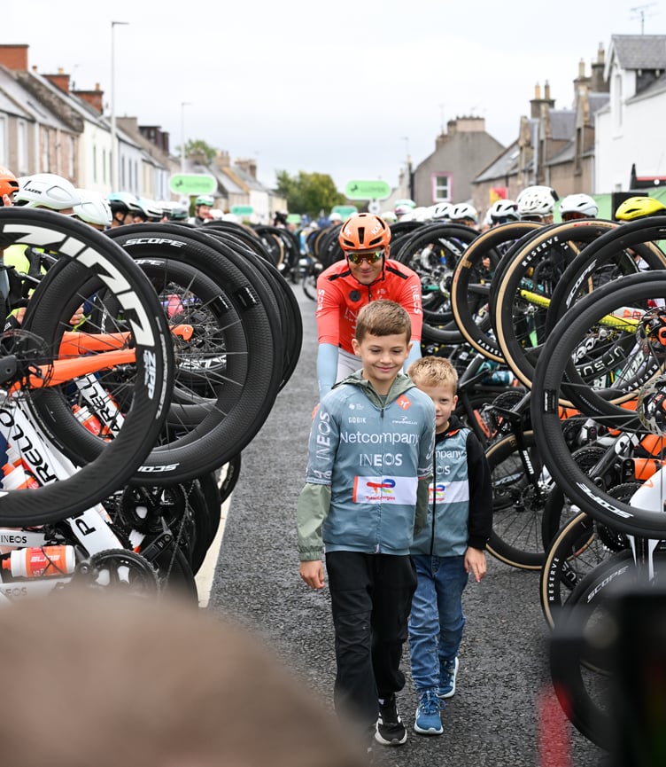 Isle of Man cyclist Ben Swift and his two sons are given a guard of honour by fellow riders ahead of the final stage of this year's Tour of Britain, his last appearance in the event (Photo: Zac Williams/SWpix.com)