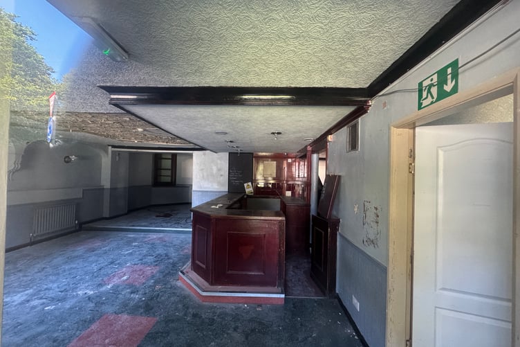 How the inside of the former Quarterbridge pubs looks through the window