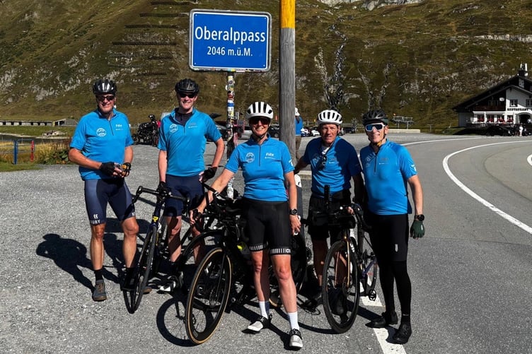 Pictured taking a well-earned break from their bike ride at the Oberalppass in the Swiss Alps are (left to right) Steve Dawes, Patrick Hill, Teresa Robbins, Gary Shaughnessy and Marcel Steinmann