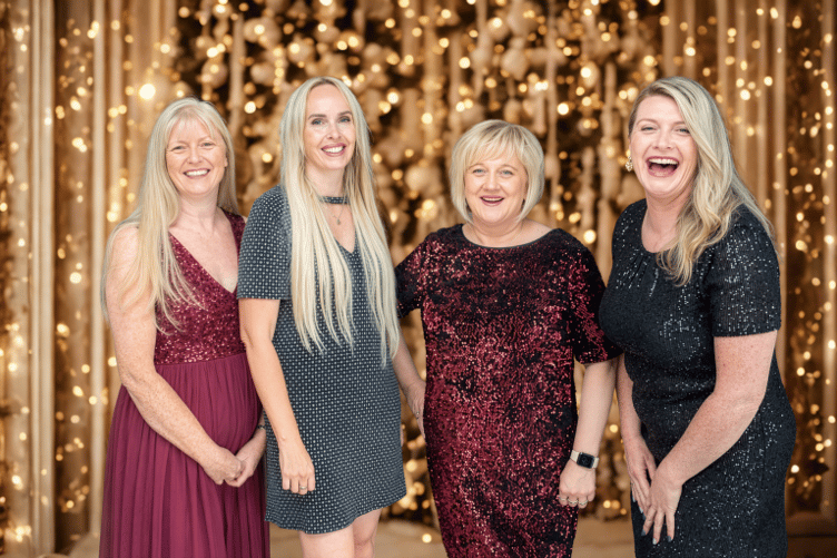 (L-R) Pre-loved fashion, modelled by Hospice staff Niomi Phillips, Pauline Pritchard, Sylwia Borejsza and Gina Fleming to showcase the type of beautiful eveningwear, occasionwear and accessories the charity hopes Islanders will donate to Sparkle for Christmas