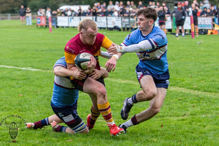 Craig Martin wrestles with a couple of Wilmslow opponents at Port-e-Chee (Photo: Richard Ebbutt)