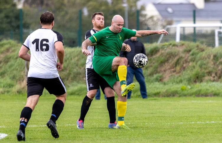 Mark Wolfenden (right) helped himself to a five-goal haul for St Mary's against Colby in the Canada Life Premier League on Saturday afternoon (Photo: Gary Weightman)