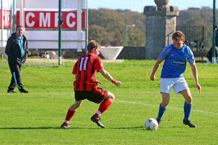 Castetown's Jack Wallis looks for a way past Malew's Kieran Krypner at The Stadium (Photo: Paul Hatton)