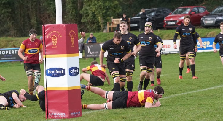 Harry Cartwright dives over to score for Douglas during their 34-21 win over Burnage in January (Photo: Richard Ebbutt)