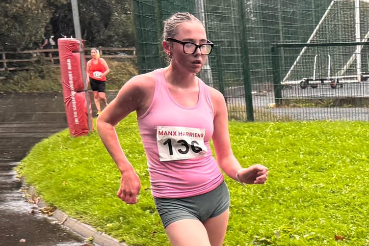 Holly Salter on her way to finishing third in the one-hour walk at a rain-soaked NSC last Sunday (Photo: Steve Partington)