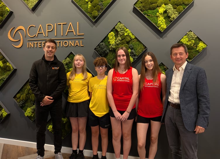 (Left to right) Isle of Man Netball performance director Paul Jones, junior players Lottie, Nathan, Lola and Amelie along with Capital International group strategy officer David Long