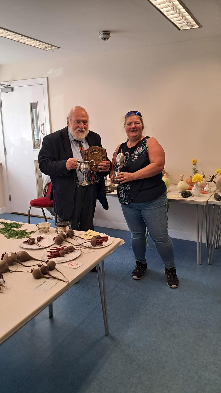 Peter Kelly and Cheryl Wrench, all smiles with her trophy