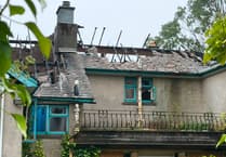 Road reopens following huge fire at derelict apartment block