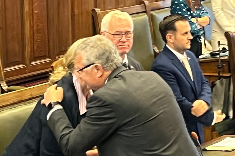 A touching moment: Chris Thomas and Kirrie Jenkins share a hug after an honest campaign for the top role in Manx politics
