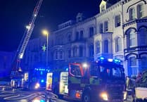 Twelve people taken to hospital after fire at flats