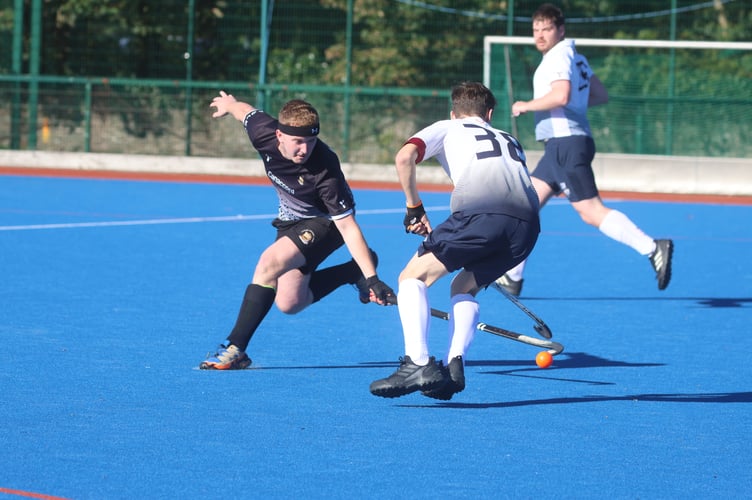 Vikings' Eddie Caley at full stretch to try and take the ball from Bacchas B's George M during Saturday's Mixed Premiership clash. Caley helped his side win 4-0 (Photo: Paul Hatton)