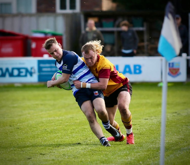 Douglas man of the match Craig Martin tackles a Winnington Park opponent (Photo: Richard Ebbutt)