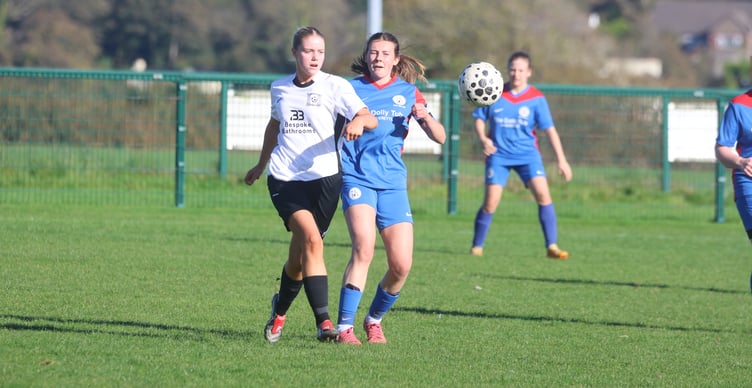 Corinthians' Lula-Belle Findlay (left) and Douglas & District's Olivia Davis compete for the ball (Photo: Paul Hatton)
