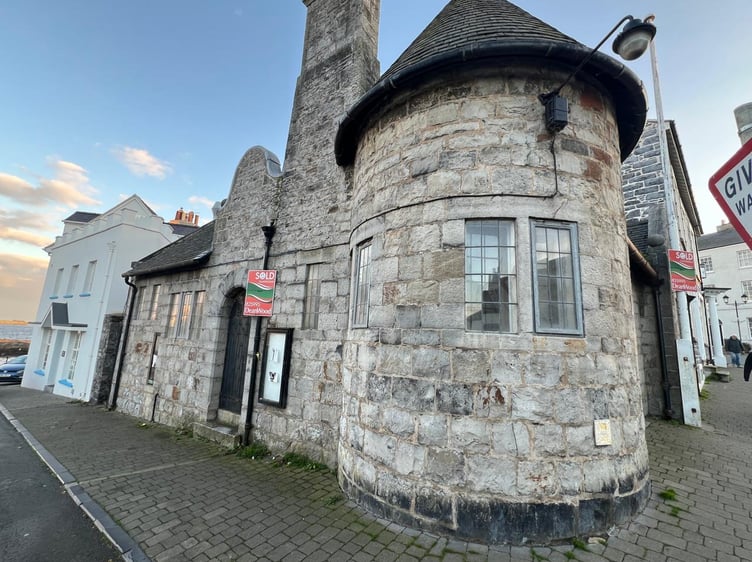 The former Police Station in Castletown with a 'sold' sign outside