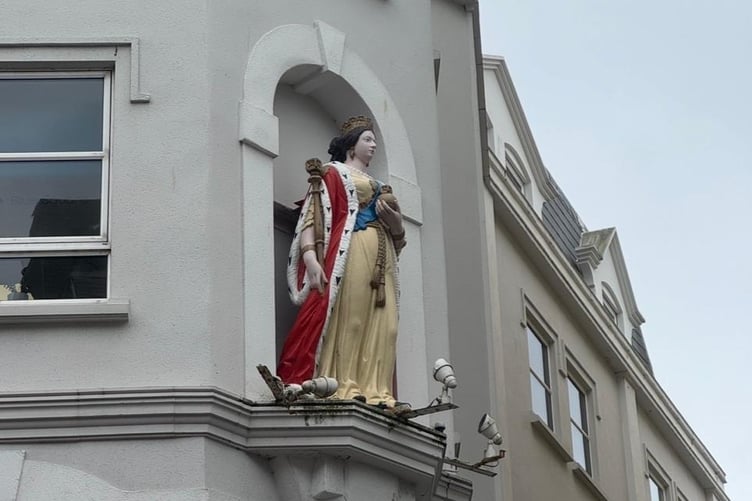 Queen Victoria can easily be missed on Victoria Street, Douglas