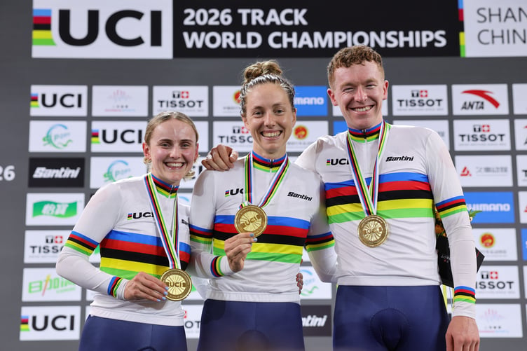 Isle of Man cyclist Matthew Bostock celebrates his scratch gold medal alongside fiancee Megan Barker (left) and Josie Knight who won gold in the women's team pursuit for Great Britain (Photo: Alex Whitehead/SWpix.com)