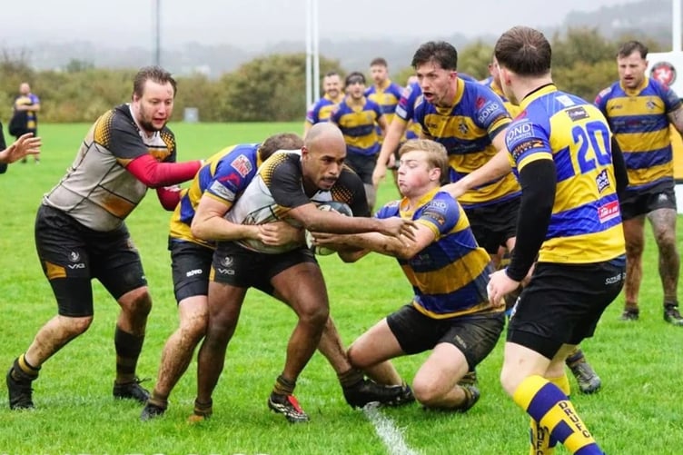 Vagabonds' Josh Modin attempts to power his way past several Dukinfield players (Photo: John Liver/Mumble's Pics)
