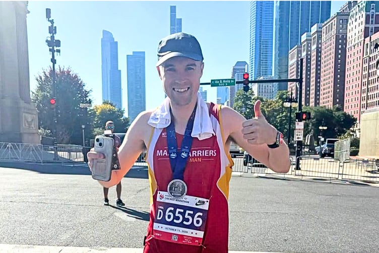 Stephen Garrett was all smiles after setting a new personal best in Chicago with a time of two hours 48 minutes and 39 seconds