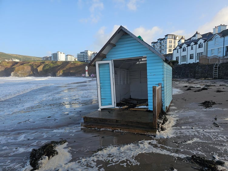 The blue beach hut cut an isolated figure in the aftermath of the storm